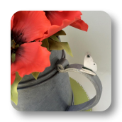 A Garden Themed Cake:  Watering Can with Edible Poppies